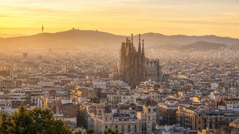 Sagrada Familia rising above Barcelona at golden hour